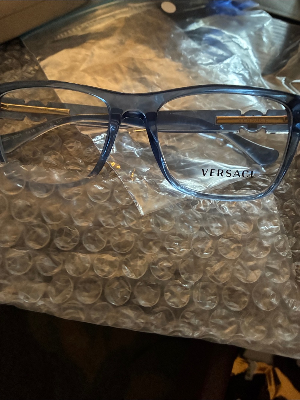 Versace Men’s Transparent Blue Rectangular Optical Glasses with Gold Accents
